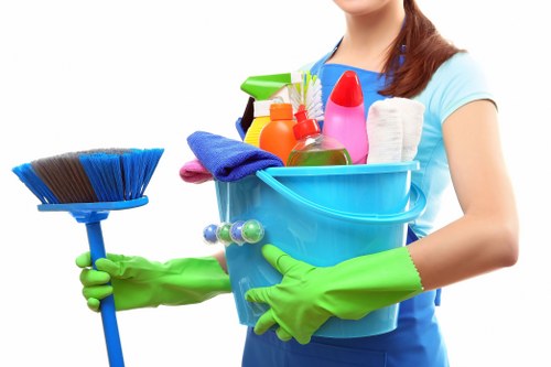 Carpet cleaning team preparing equipment with safety measures in place